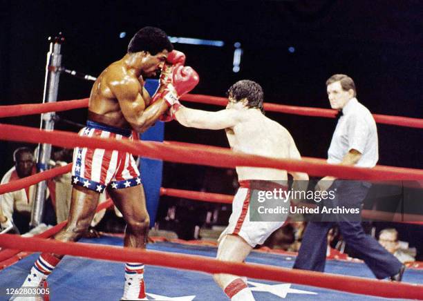 Kino. Rocky, USA Regie: John G. Avildsen, Darsteller: Carl Weathers, Sylvester Stallone.