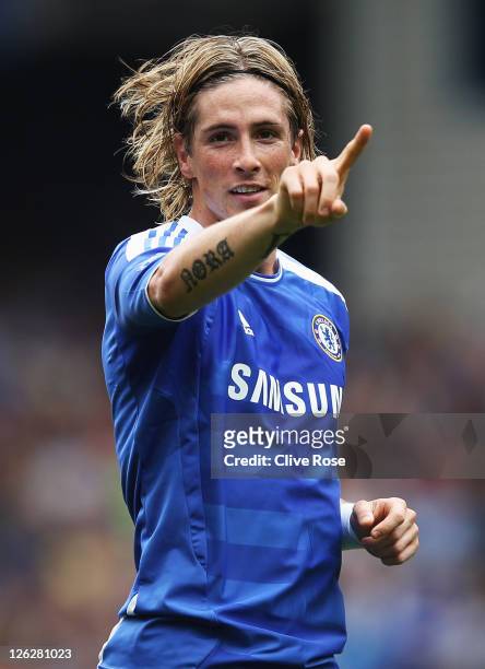 Fernando Torres of Chelsea celebrates as he scores their first goal during the Barclays Premier League match between Chelsea and Swansea City at...