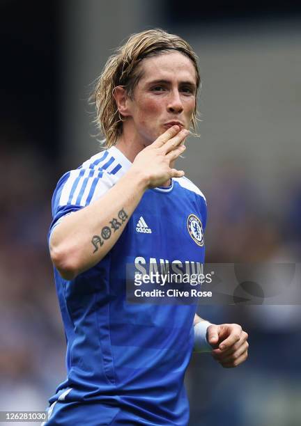 Fernando Torres of Chelsea celebrates as he scores their first goal during the Barclays Premier League match between Chelsea and Swansea City at...