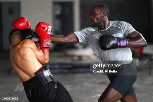 New York Golden Gloves boxer Dennis Guerrero spars with recreational boxer Raheem Yusuff during a final boxing workout at Jetty gym on July 30, 2020...