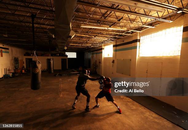 Recreational boxer Raheem Yusuff spars with three time New York Golden Gloves boxer Anthony Lopez during a final boxing workout at Jetty gym on July...