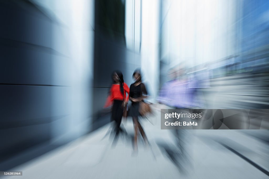Office Workers Walking Past Business Building