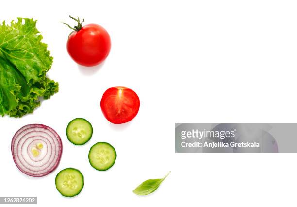 fresh organic vegetables on white background - cucumber leaves stock-fotos und bilder
