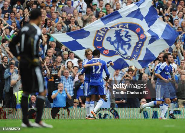 Fernando Torres of Chelsea celebrates with John Obi Mikel as he scores their first goal during the Barclays Premier League match between Chelsea and...