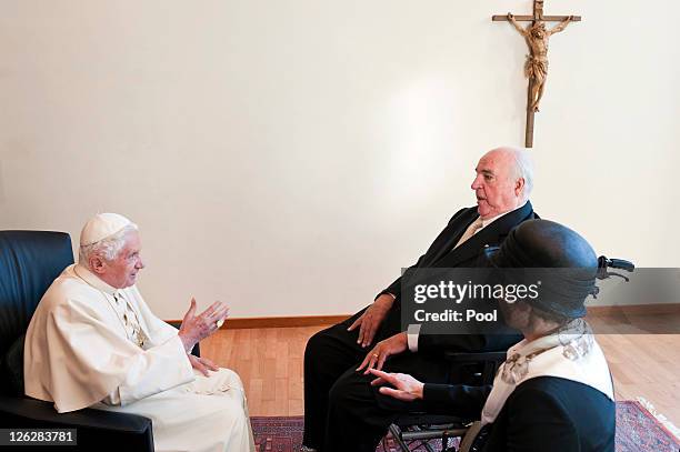 In this image provided by the German press office Pope Benedict XVI talks with former German Chancellor Helmut Kohl and his wife Maike Kohl-Richter...