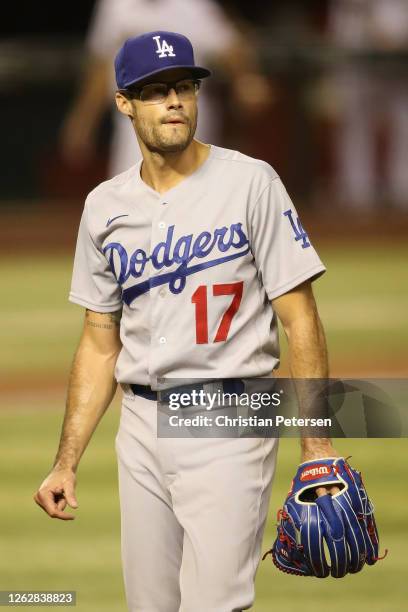 Relief pitcher Joe Kelly of the Los Angeles Dodgers walks off the field after pitching against the Arizona Diamondbacks during the seventh inning of...