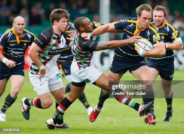 Kai Horstmann of Worcester Warriors is tackled by Jordan Turner-Hall of Harlequins during the AVIVA Premiership match between Worcester Warriors and...