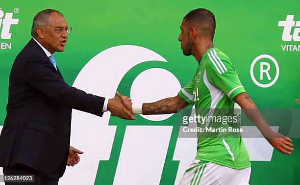 Felix Magath , head coach of Wolfsburg shake hands with Ashkan Dejagah of Wolfsburg during the Bundesliga match between VfL Wolfsburg and 1. FC...