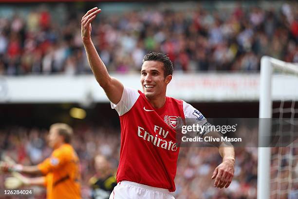 Robin Van Persie of Arsenal celebrates his second goal during the Barclays Premier League match between Arsenal and Bolton Wanderers at Emirates...