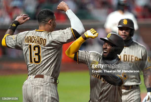 Jurickson Profar and Manny Machado of the San Diego Padres celebrates after Profar's two-run home run against the San Francisco Giants in the top of...