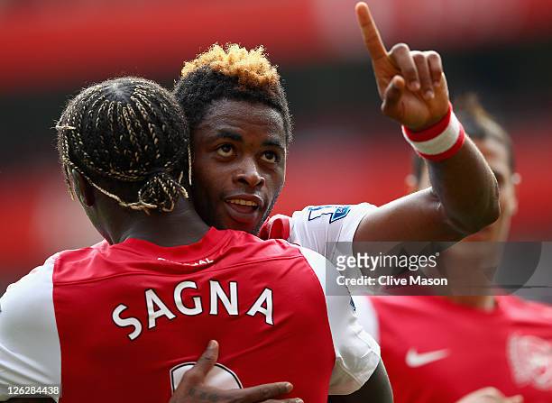 Alex Song of Arsenal celebrates his goal with team mate Bacary Sagna during the Barclays Premier League match between Arsenal and Bolton Wanderers at...