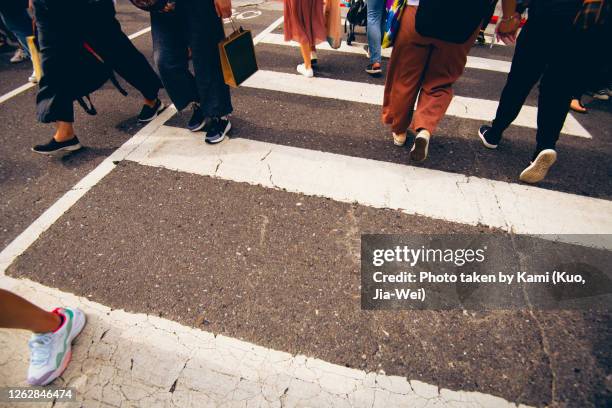 zebra crossing with lot of pedestrians walked on it at taipei street. - busy sidewalk stock pictures, royalty-free photos & images