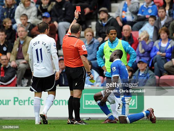 Steve Gohouri of Wigan Athletic is sent off during the Barclays Premier League match between Wigan Athletic and Tottenham Hotspur at DW Stadium on...