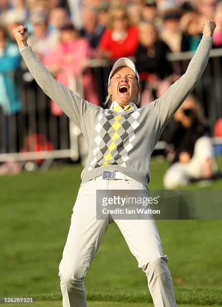 Suzann Pettersen of Europe celebrates holing a putt on the 16th green during the afternoon fourballs on day two of the 2011 Solheim Cup at Killeen...
