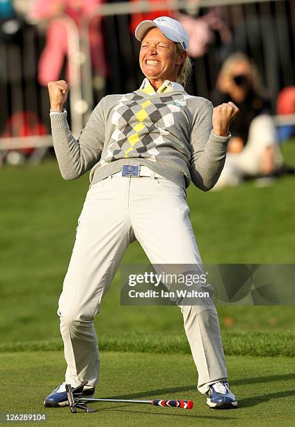 Suzann Pettersen of Europe celebrates holing a putt on the 16th green during the afternoon fourballs on day two of the 2011 Solheim Cup at Killeen...