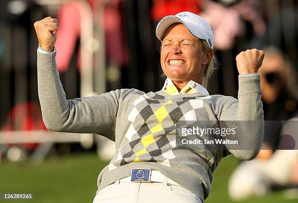 Suzann Pettersen of Europe celebrates holing a putt on the 16th green during the afternoon fourballs on day two of the 2011 Solheim Cup at Killeen...