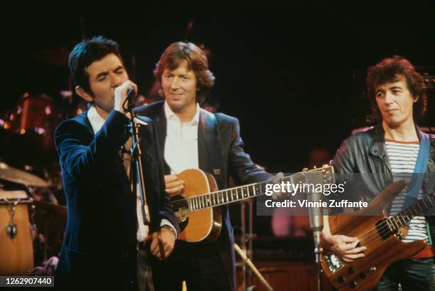 From left to right, musicians Ronnie Lane , Eric Clapton and bassist Bill Wyman at an ARMS Charity Concert at the Royal Albert Hall in London, in aid...