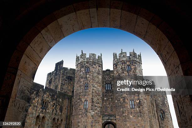 the alnwick castle, most famously known as hogwarts castle in the harry potter series - alnwick castle stock pictures, royalty-free photos & images