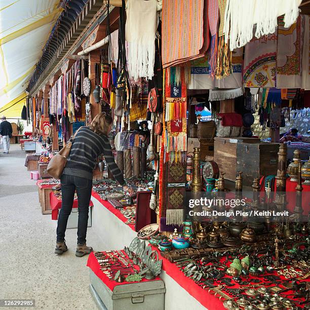 a woman shops for souvenirs - thimphu bhutan stock pictures, royalty-free photos & images