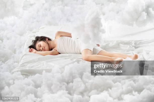 lovely little girl lying on the cloud - cotton cloud stock pictures, royalty-free photos & images