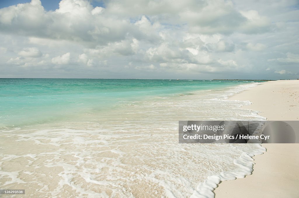 Water washing up onto the sandy beach