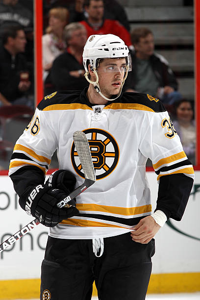 Colby Cohen of the Boston Bruins looks on during warmups prior to a game against the Ottawa Senators during the NHL pre-season game at Scotiabank...