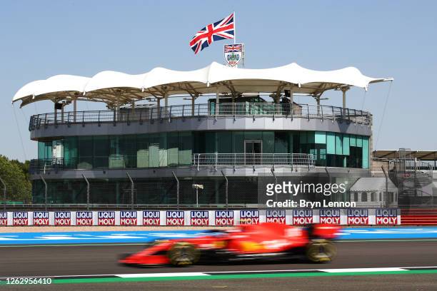 General view of the BRDC club house as Charles Leclerc of Monaco driving the Scuderia Ferrari SF1000 goes past during practice for the F1 Grand Prix...
