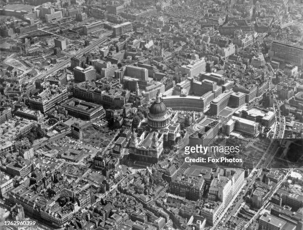 An aerial view of St Paul's Cathedral in the City of London, with the new Route 11 and Queen Victoria Street on the right, 8th July 1959.