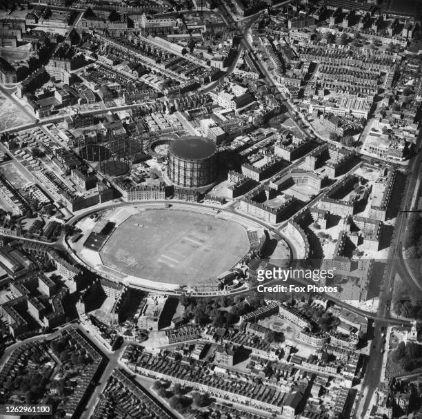 An aerial view of the Oval cricket ground in Kennington, London, with the gasometers next to it, circa 1950.