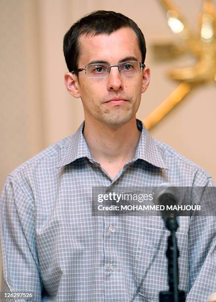 American hiker Shane Bauer speaks to the press at Muscat International airport on September 24 before flying home to the USA. Bauer and Josh Fattal...