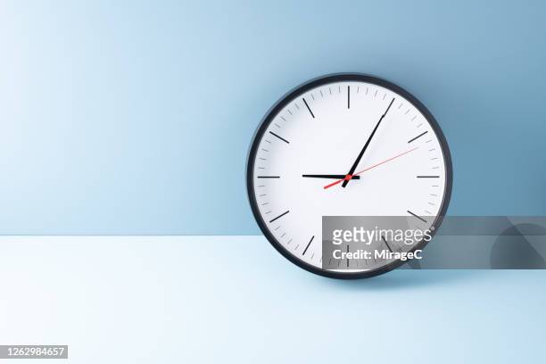 at the beginning of 9 o'clock - clock face stock pictures, royalty-free photos & images