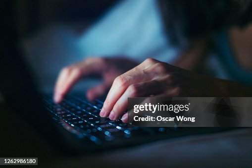 Close-up Shot Of Young Woman Working Late With Laptop In The Dark Close-up Shot Of Young Woman Working Late With Laptop In The Dark