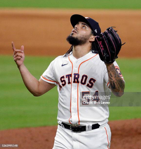 Roberto Osuna of the Houston Astros looks upward after finishing an inning against the Los Angeles Dodgers at Minute Maid Park on July 29, 2020 in...