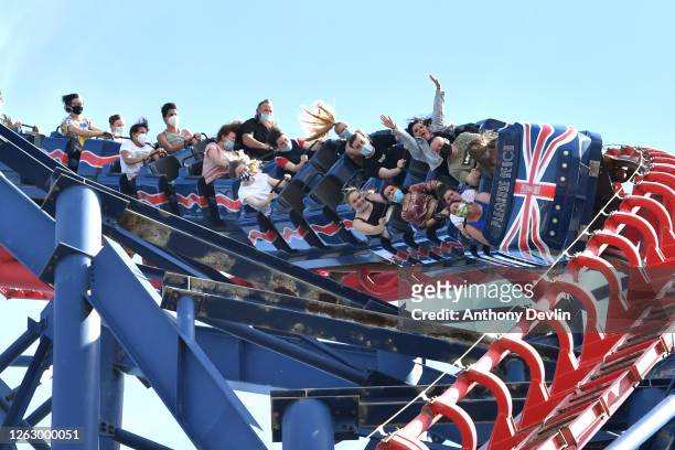 People ride on the Big One rollercoaster at Blackpool Pleasure Beach on July 31, 2020 in Blackpool, England. High temperatures are forecast across...