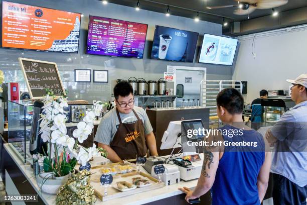 Florida, Orlando, Little Vietnam, Paris Banh Mi Cafe Bakery, cashier counter.