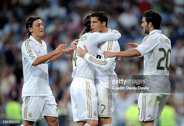 Cristiano Ronaldo of Real Madrid celebrates with Mesut Ozil and Gonzalo Higuain after scoring Real's 4th goal during the La Liga match between Real...
