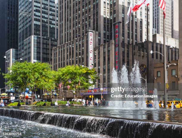 Radio City seen over the fountain in Sixth Street, New York, New York State, United States of America.