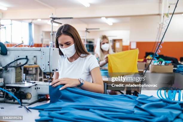 textile industry workers - needle plant part stock pictures, royalty-free photos & images