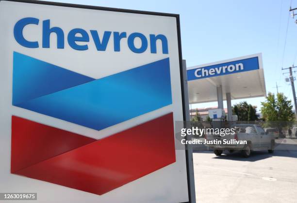 Sign is posted in front of a Chevron gas station on July 31, 2020 in Novato, California. Chevron Corp reported a $8.27 billion loss in second quarter...