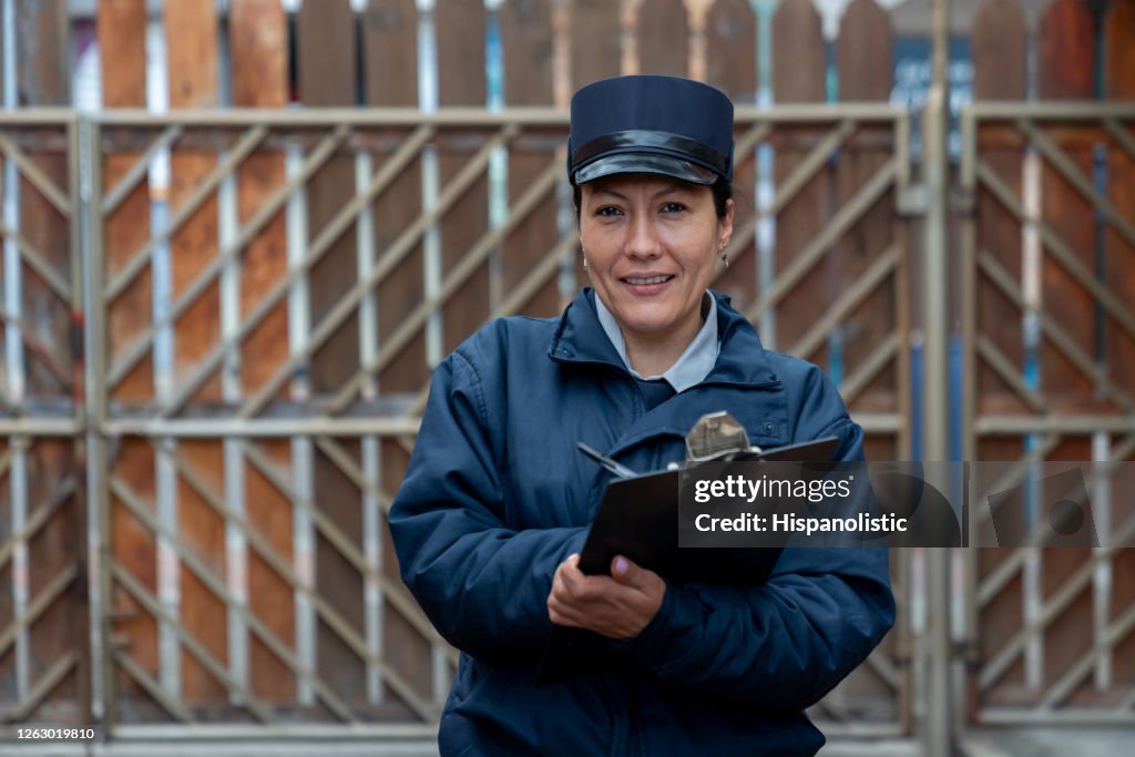 Security guard working at a gated community and looking at the camera smiling