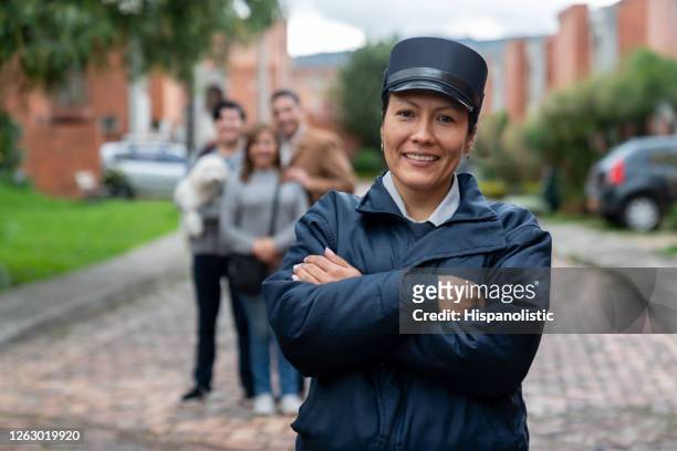happy security guard working at a gated community protecting people - colombia police stock pictures, royalty-free photos & images