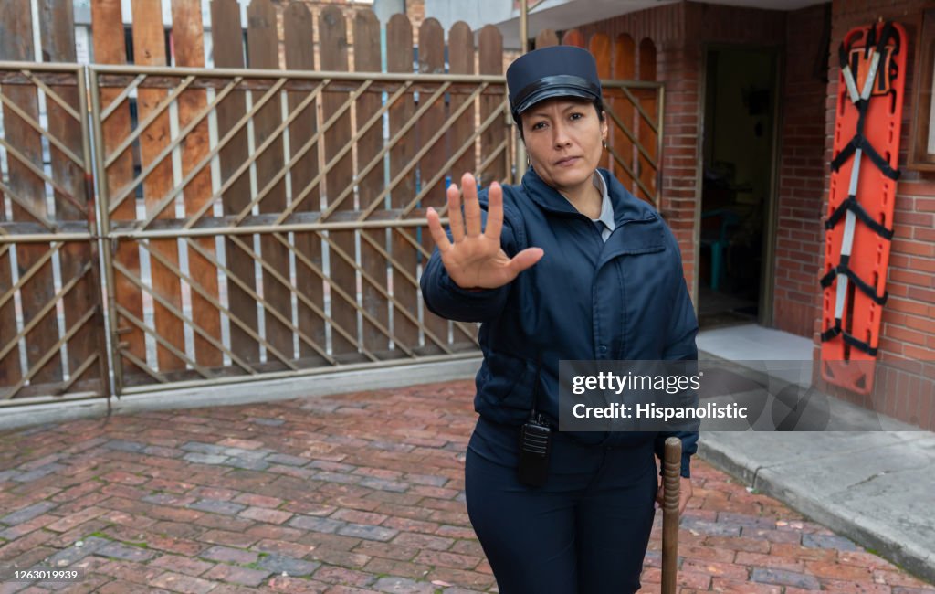 Security guard preventing people from trespassing private property
