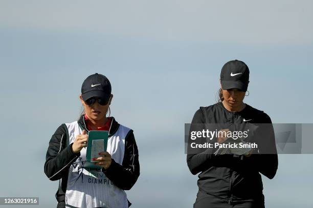 Cheyenne Woods and her caddie prepare for a shot from the 15th tee during the first round of the LPGA Drive On Championship at Inverness Club on July...