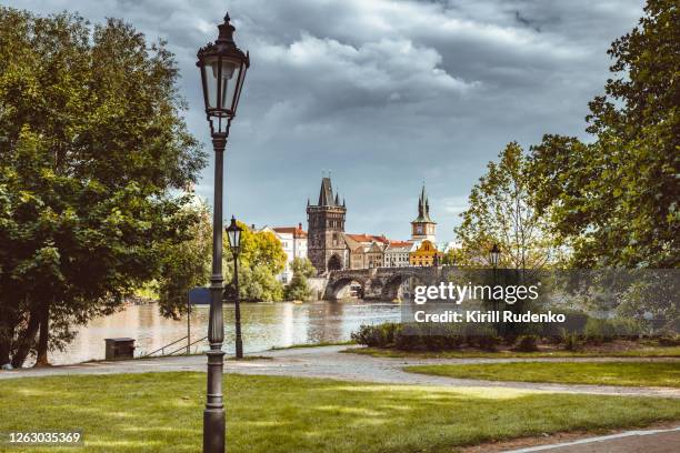 vltava river and charles bridge seen from lesser town, prague, czech republic - prague river stock pictures, royalty-free photos & images