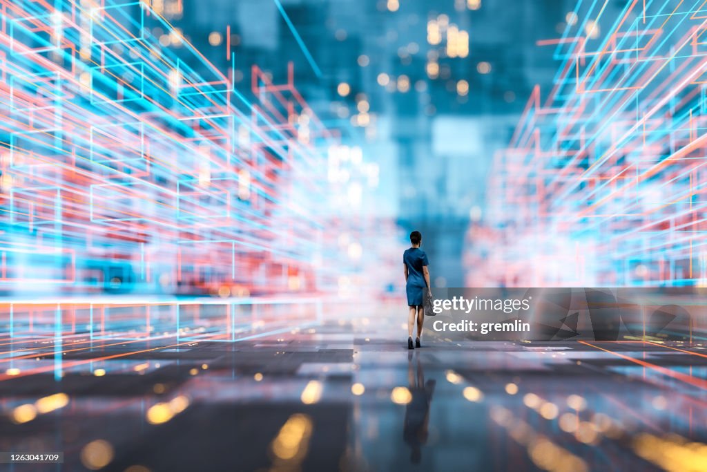 Futuristic city VR wire frame with businesswoman walking