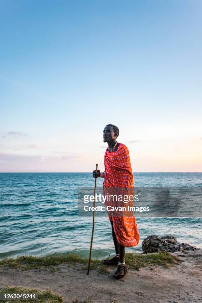 maasai man on the beach - kenya business stock pictures, royalty-free photos & images
