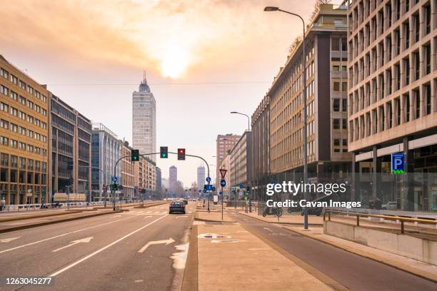 vittor pisani street near central station in milan city downtown - pollution in milan stock pictures, royalty-free photos & images