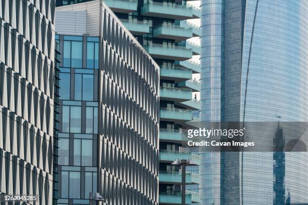 closeup of towers at porta garibaldi financial district business center - milan square stock pictures, royalty-free photos & images