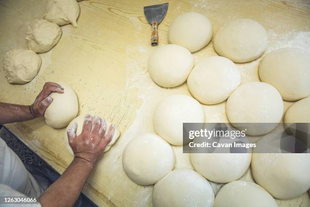 only hands shaping dough at a bakery in belgrade, serbia - relfection stock pictures, royalty-free photos & images