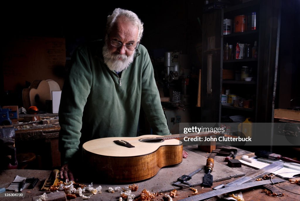 The Guitar Maker with finished guitar